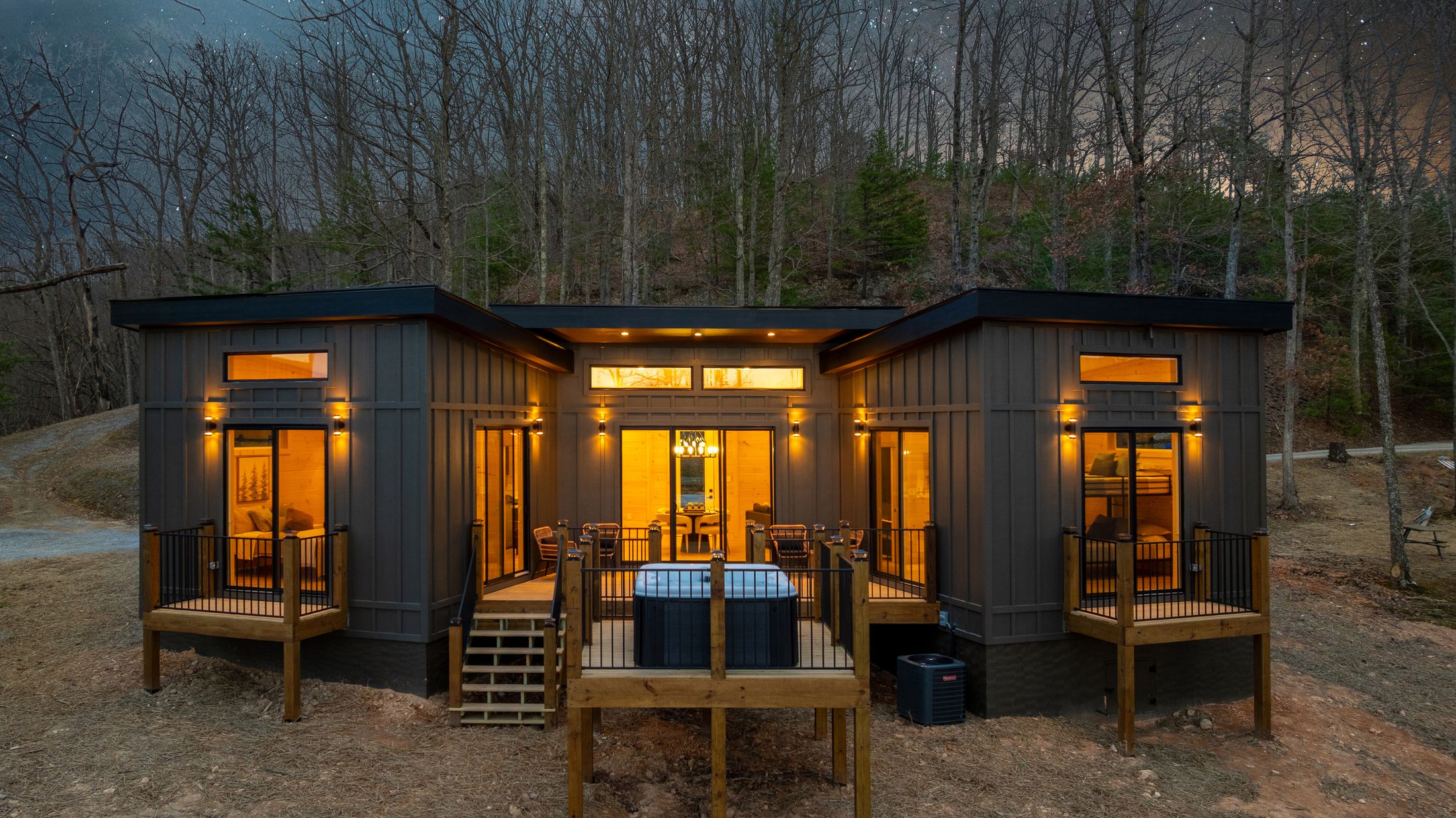 Modern short-term-rental cabin at dusk in the Smoky Mountains